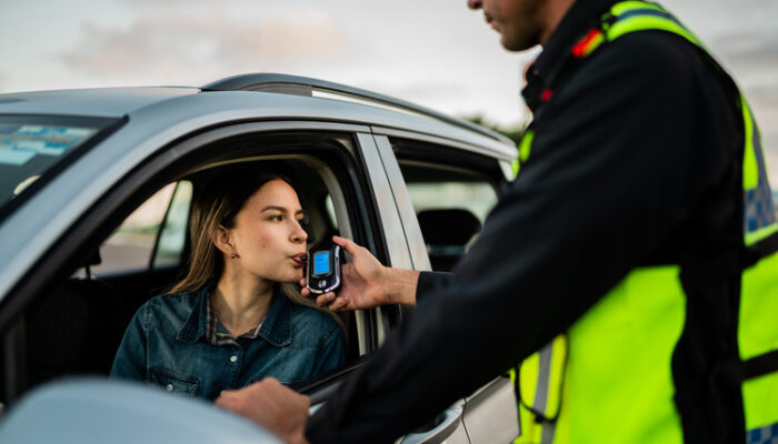 woman taking breathalyzer in PA
